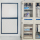 Helios Docking Station mounted to the wall in a clinical setting with a mobile storage cabinet next to it.